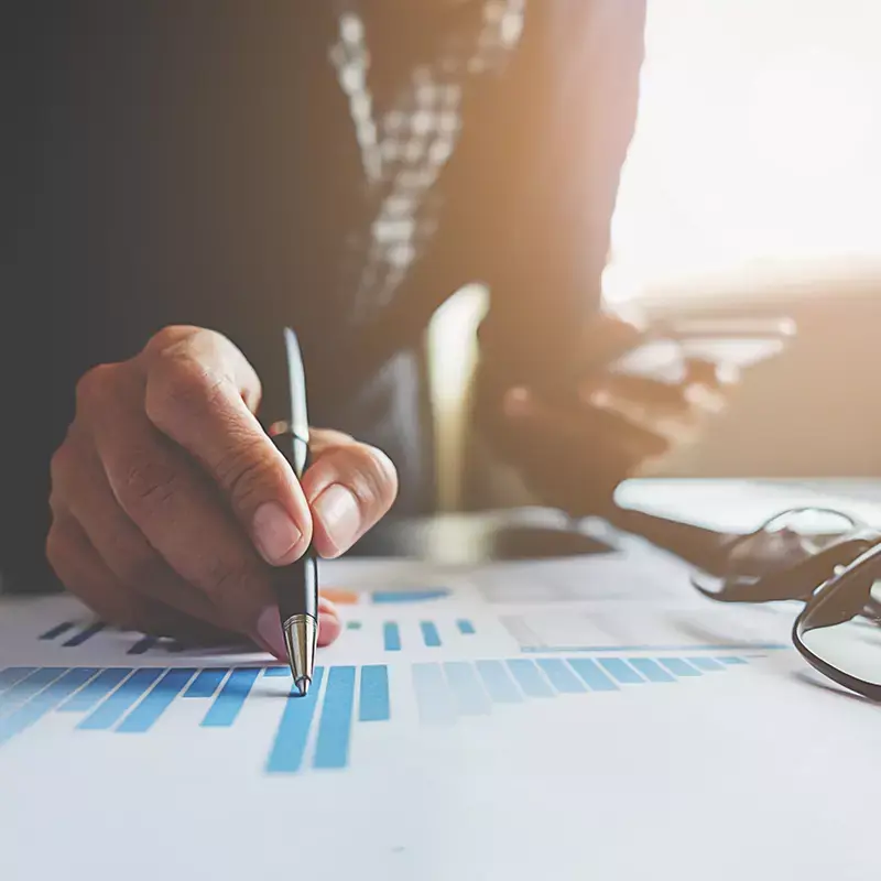 Analyst reviewing recovery performance charts at a desk